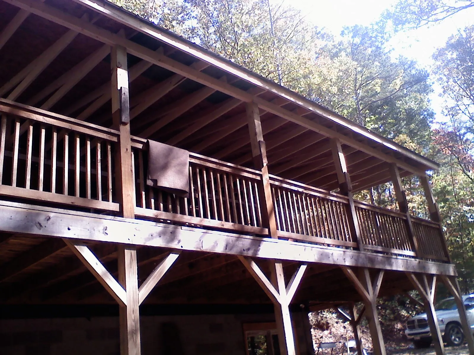 Timber framing under a new elevated porch and deck — Roof Leak Repair in Buhler by Roofing Brothers